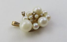 A 9ct gold pearl and diamond set pendant, the nine