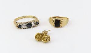 A 9ct gold black onyx ring, finger size L but out