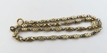 A gold length of chain with alternate fancy rectan