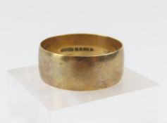 A 9ct gold wide wedding band, 1980, finger size X,