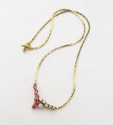 A ruby and diamond set necklace, the elongated V s