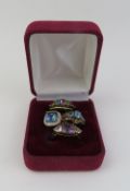 A 9ct gold coated topaz set ring, the central square cus