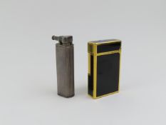 A vintage white metal Dunhill lighter, the body ri