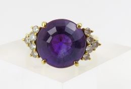 An amethyst and diamond dress ring, the round face