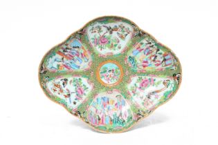 A lobed Chinese Canton famille rose bowl with palace scenes, fauna and flora, 19th C.