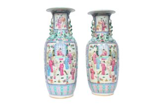 A pair of Chinese famille rose 'scholars' vases, 19th C.
