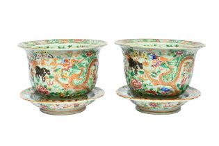 A pair of Chinese Canton famille rose celadon ground 'mythical animals' jardinieres on stand, 19th C