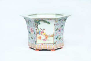 A Chinese hexagonal famille rose jardiniere with ladies in a garden and floral design, 20th C.