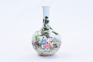 A Chinese famille rose vase with children at a tea ceremony, Qianlong mark, 20th C.