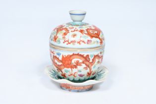 A Chinese famille rose 'dragons' bowl and cover on stand, Qianlong mark, 19th C.