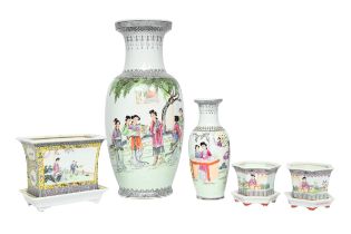 Two Chinese famille rose vases and three jardinieres on stands, 20th C.