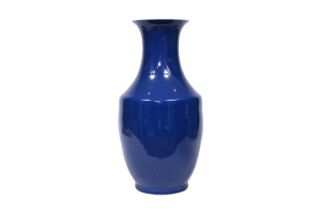 A Chinese monochrome blue glazed vase, 19th C.