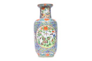 A Chinese Canton famille rose blue ground vase with animals and floral design, 19th C.