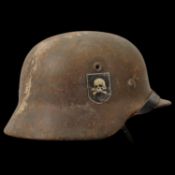 Rare WWII Nazi German M40 SS Combat Helmet with Totenkopf emblem on the side, liner and chin strap.