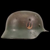 WWII Nazi German M40 SS Combat Helmet in camouflage paint, SS emblem.
