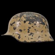 WWII Nazi German M40 Combat Helmet featuring original tan camouflage.
