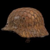 WWII Nazi German M40 Combat Helmet with iron mesh for attaching camouflage.