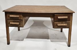 Early 20th century oak office desk, the rectangular top over an arrangement of four drawer, each