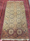 Old antique Afghan rug with 16 symbols in dark blue, brown and rust with cream (faded in centre),