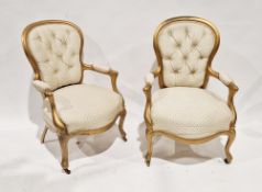 Pair of 20th century giltwood button back armchairs, raised on front cabriole legs, 90cm high