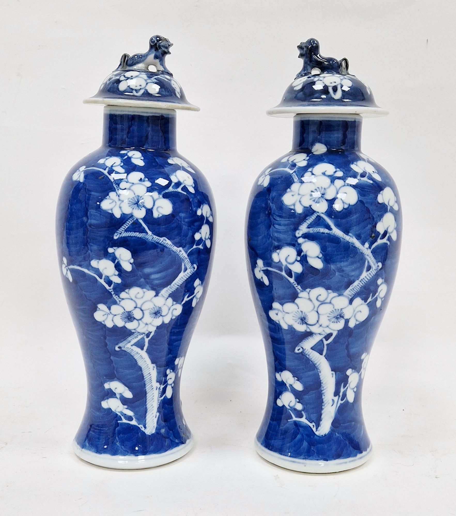 Pair of 19th century Chinese porcelain blue and white baluster prunus-pattern vases and matched