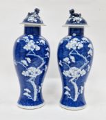 Pair of 19th century Chinese porcelain blue and white baluster prunus-pattern vases and matched