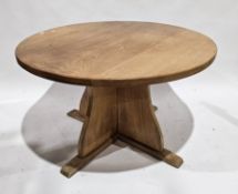 Modern pale oak dining table, the circular top on a substantial cross-form base, 123cm diameter x