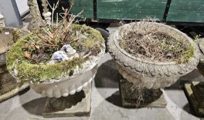 Pair of composite stone garden terrace urns of campana form, with moulded acanthus leaf rim and
