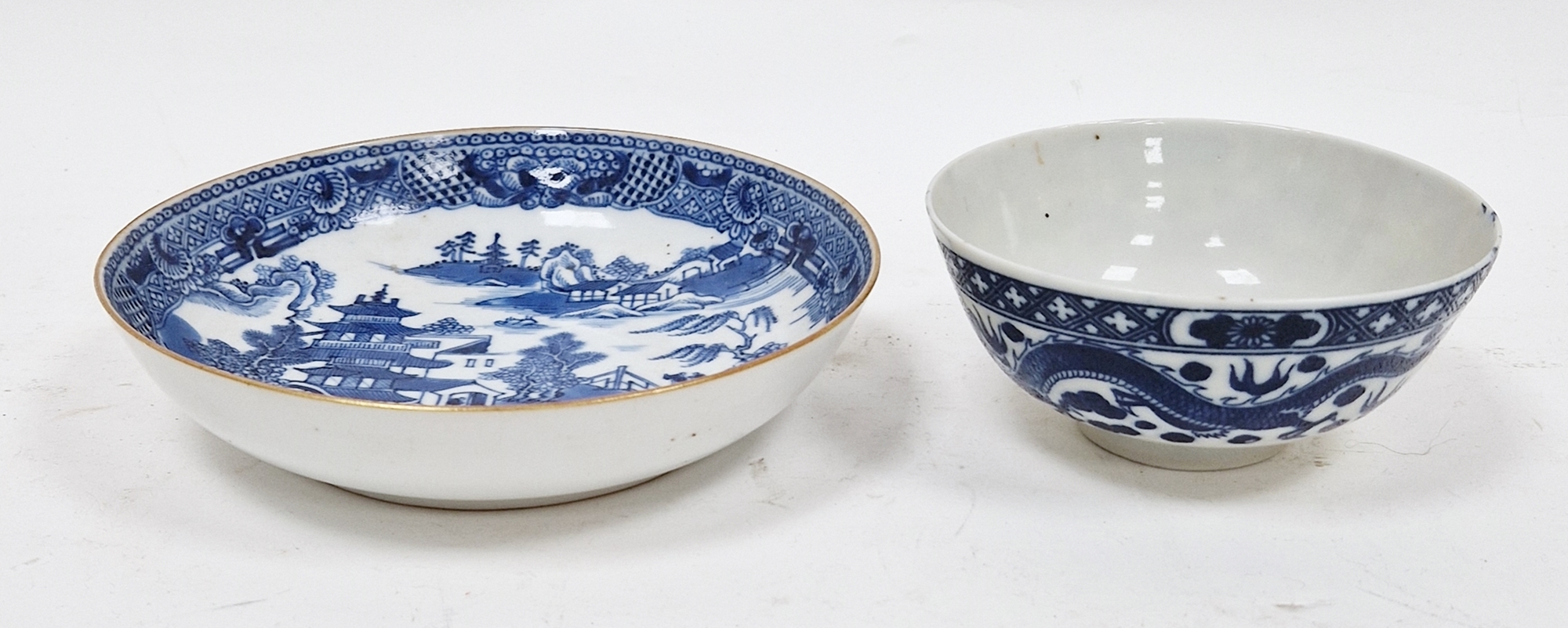 Chinese export blue and white saucer and a Chinese porcelain-style tea bowl, each printed in blue