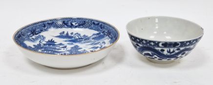Chinese export blue and white saucer and a Chinese porcelain-style tea bowl, each printed in blue