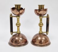 Pair of Arts and Crafts copper and brass candlesticks in the manner of Christopher Dresser for