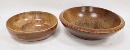 Two treen bowls in sizes, the first, turned, 19th century 36cm diam. and a smaller polished bowl