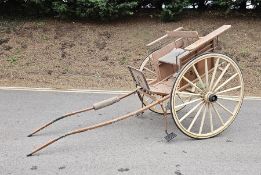 Painted wooden horse gig or carriage, full size with two spoke wheels and twin shafts for a single