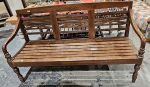 Stained hardwood garden/conservatory bench with carved floral splats and slatted seat base, raised