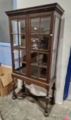 Early 20th century Jacobean revival oak display cabinet, the moulded cornice with dentil carving
