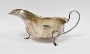 George V silver sauceboat, Sheffield 1933, Viner's Ltd, of plain form with wavy rim, scroll loop