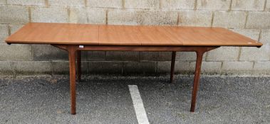 Mid-century teak extending dining table by McIntosh, the rectangular top on four turned legs, 74cm