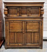 Oak court cupboard in the 17th century manner, the upper section with two panel cupboard doors