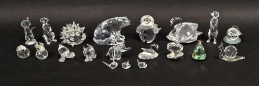 Collection of Swarovski crystal animals in boxes including swan, polar bear, snail, elephant,