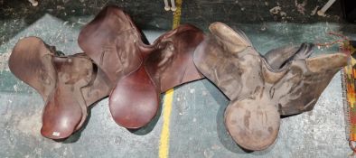 Three vintage brown leather saddles, two bearing label for J T Barrett Saddler, Redditch (3)