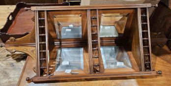 19th century Aesthetic Movement mahogany hanging corner cabinet, with bevelled panel mirrored