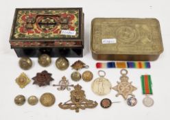 Collection of military items including a Queen Mary 1914 Christmas tin, two World War I medals