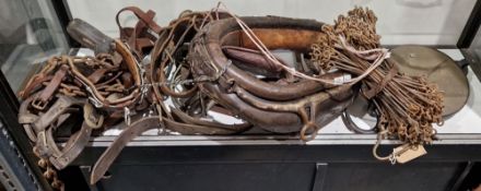 Assorted leather tack, a brass-mounted brown leather horse collar, stirrups and other associated