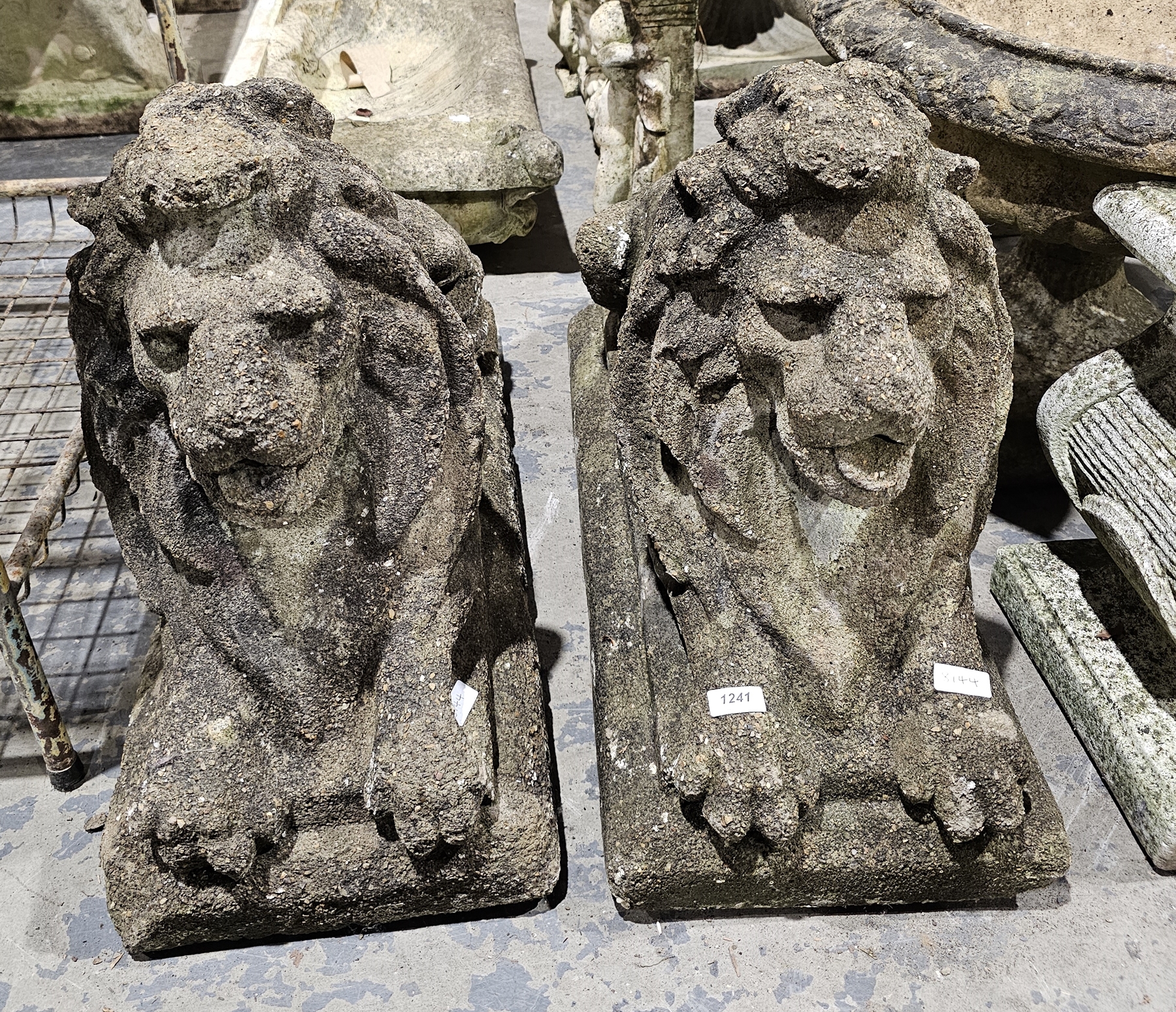 Pair of composite stone Chatsworth style garden recumbent lions, 50cm high x 70cm long Property of