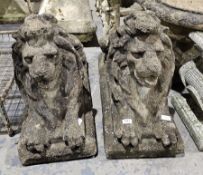 Pair of composite stone Chatsworth style garden recumbent lions, 50cm high x 70cm long Property of