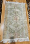 Persian style Marks & Spencer viscose cream ground rug with central hooked hexagonal medallion