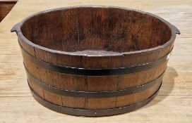 19th century coopered oak two-handled oval tub, with studded iron banding and handles, h. 24cm, l.