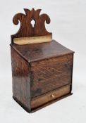19th century oak candle box with single drawer to the front and pierced and carved finial, 43cm high