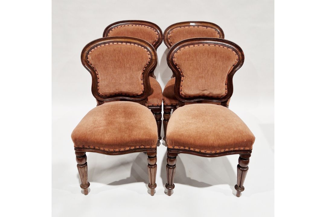 Set of four Victorian mahogany dining chairs with later pink upholstered back panels and stuff-
