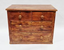 19th century small pine chest of two short over two long drawers with wooden knob handles (lacking